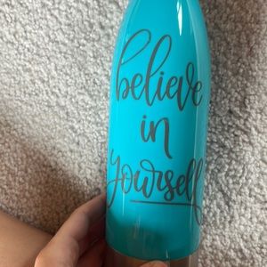 Blue 22oz with grey lettering believe in yourself. Hand wash only